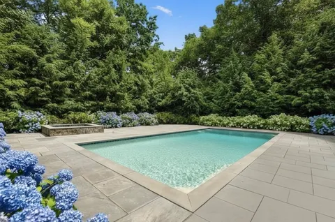 a view of swimming pool with chair