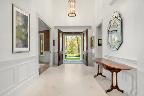 a view of a livingroom with furniture and a window