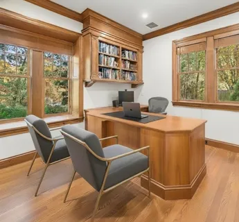 a dining room with furniture and a window