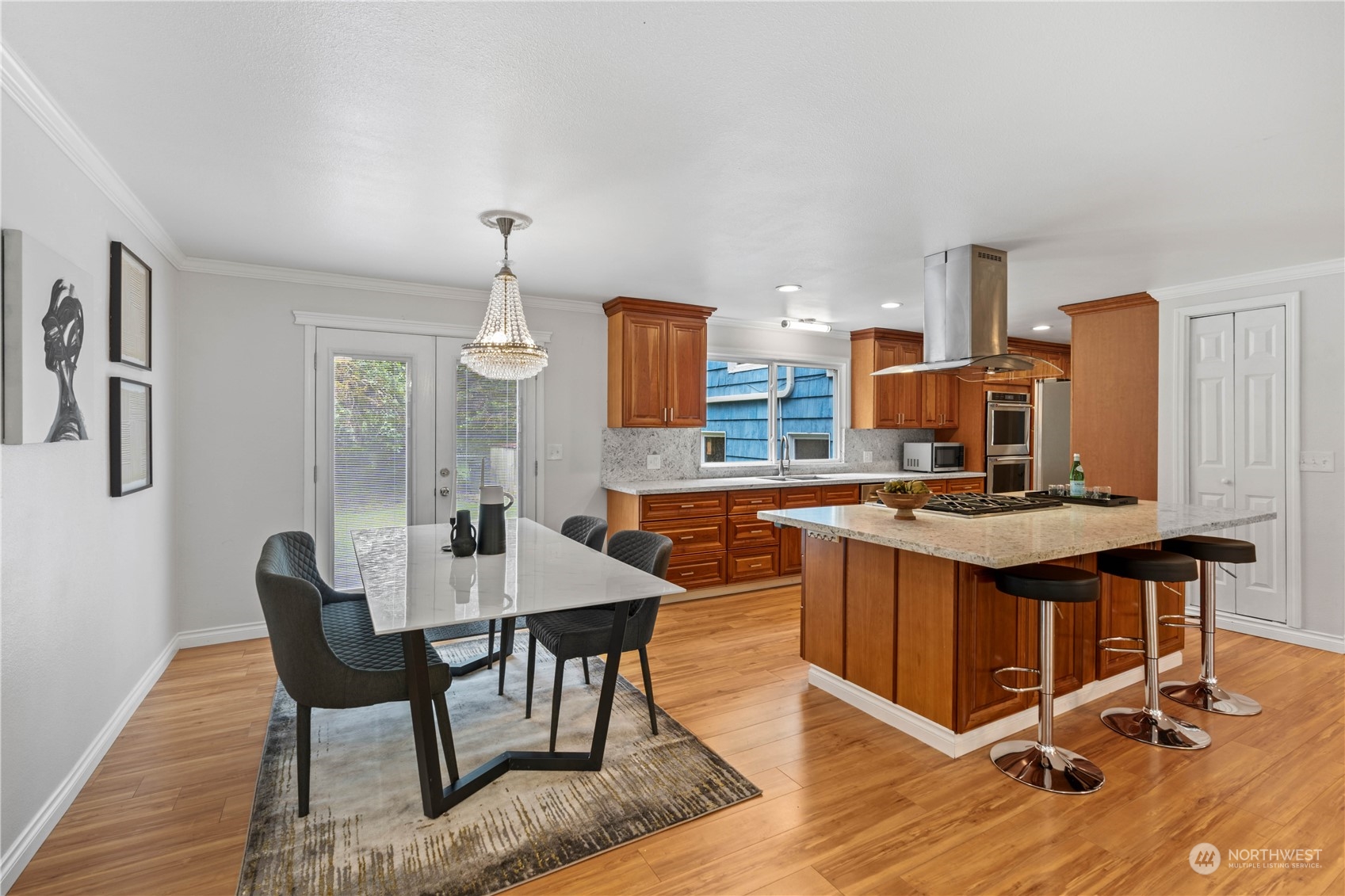 11420 Tower Road Southwest Lakewood, WA 98498 - Photo 15 of 40 a kitchen with a table chairs and a stove