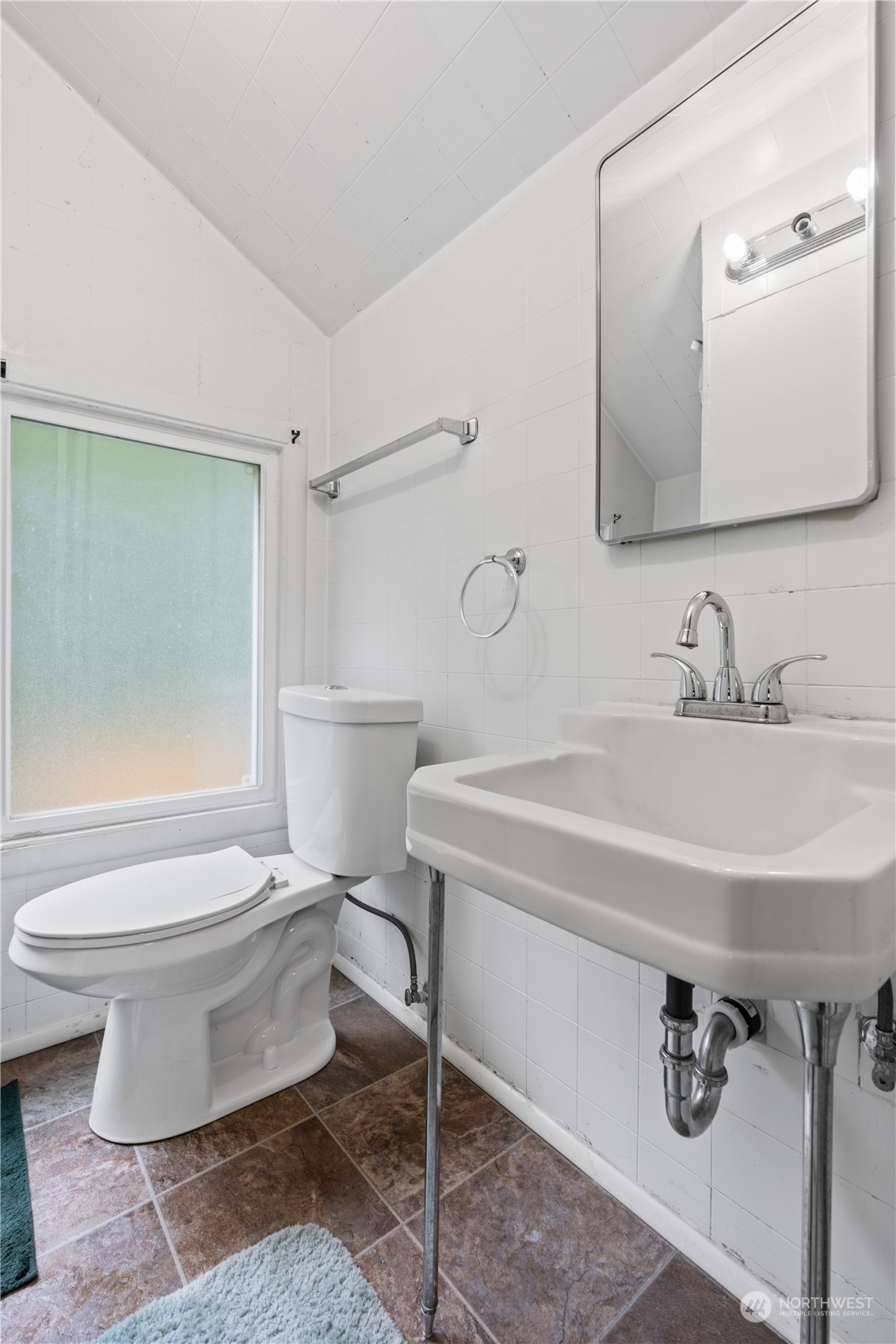 11420 Tower Road Southwest Lakewood, WA 98498 - Photo 28 of 40 a bathroom with a sink toilet and shower