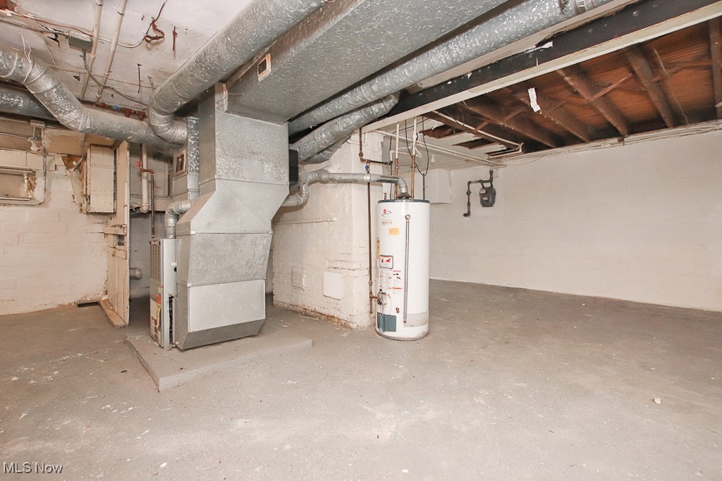 3973 Navahoe Road Cleveland, OH 44121 - Photo 14 of 14 Unfinished below grade area with heating unit and gas water heater