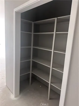 a view of an empty room with empty racks