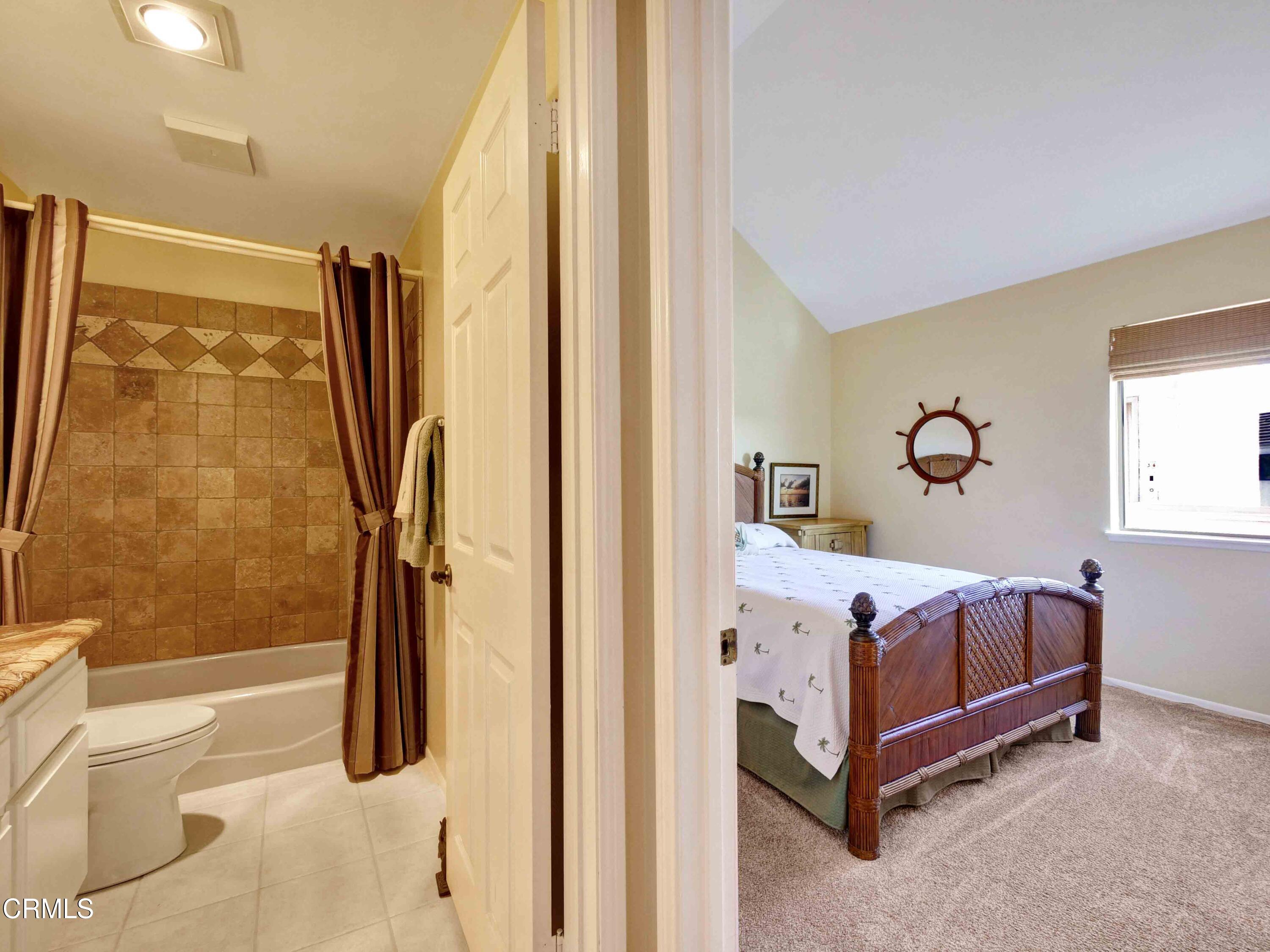 558 Terrace View Place Port Hueneme, CA 93041 - Photo 21 of 52 a bedroom with a bed and a window