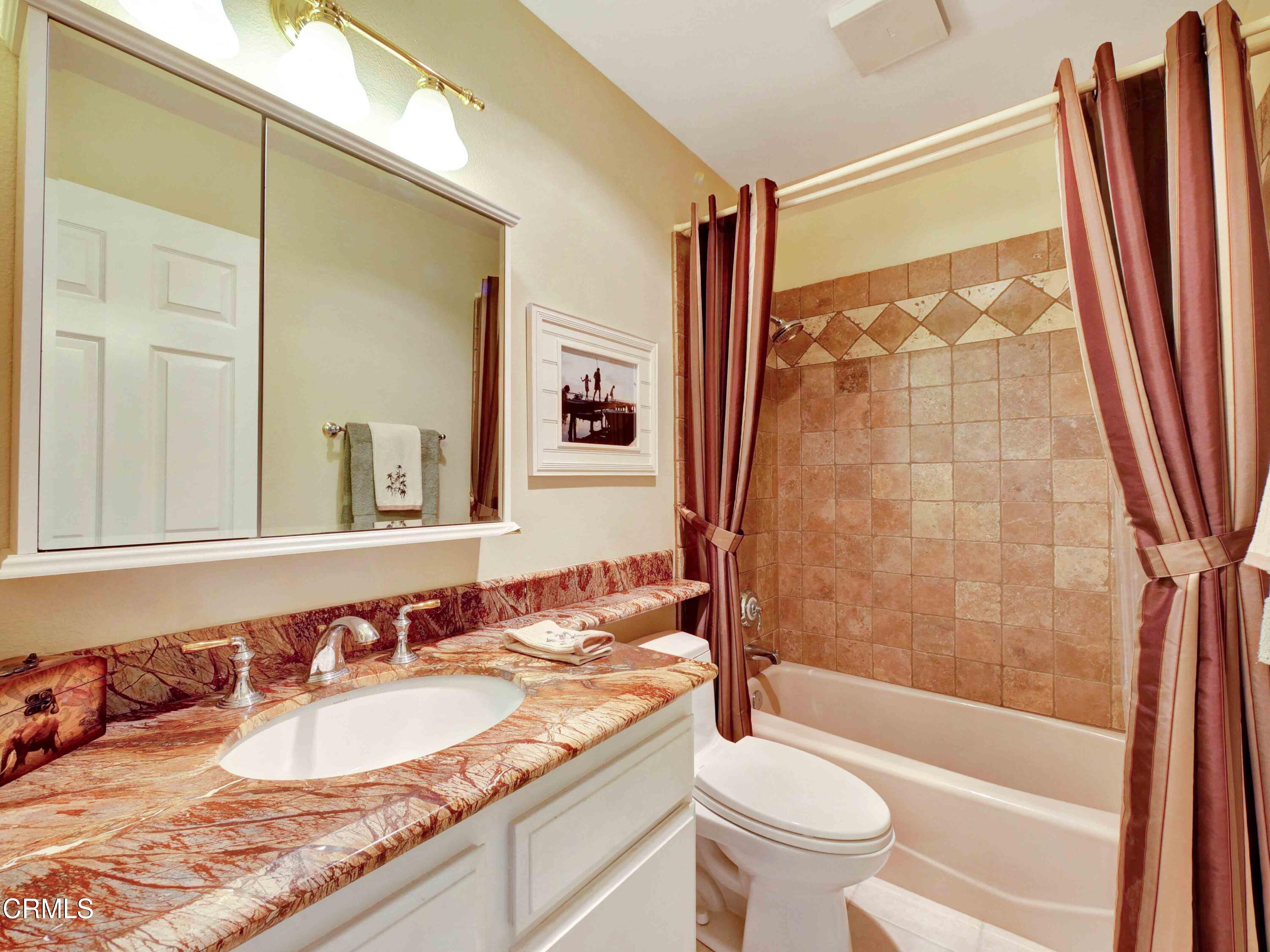 558 Terrace View Place Port Hueneme, CA 93041 - Photo 22 of 52 a bathroom with a granite countertop sink toilet and shower