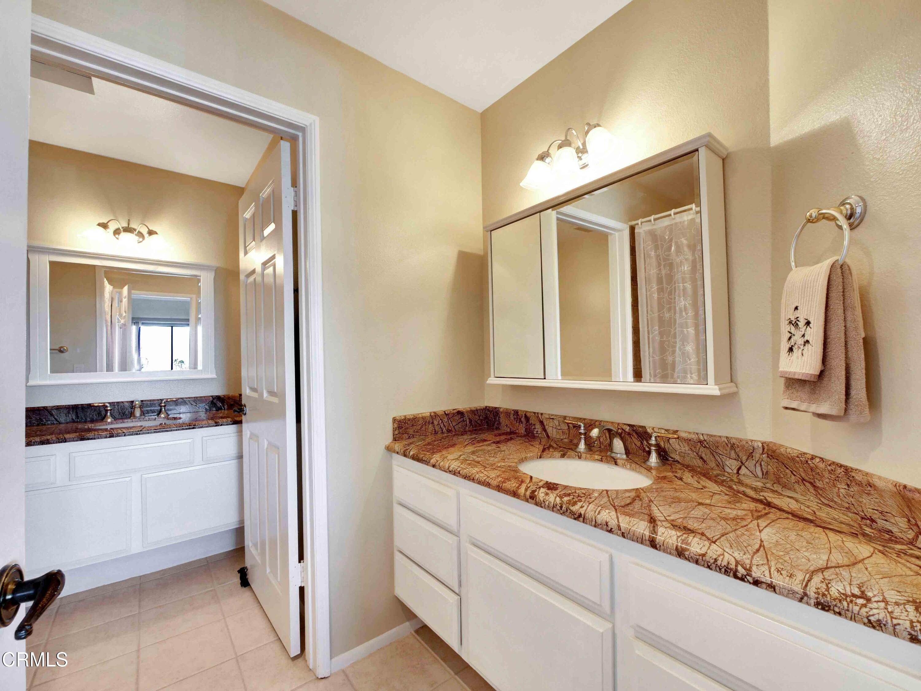 558 Terrace View Place Port Hueneme, CA 93041 - Photo 33 of 52 a bathroom with a sink and a mirror