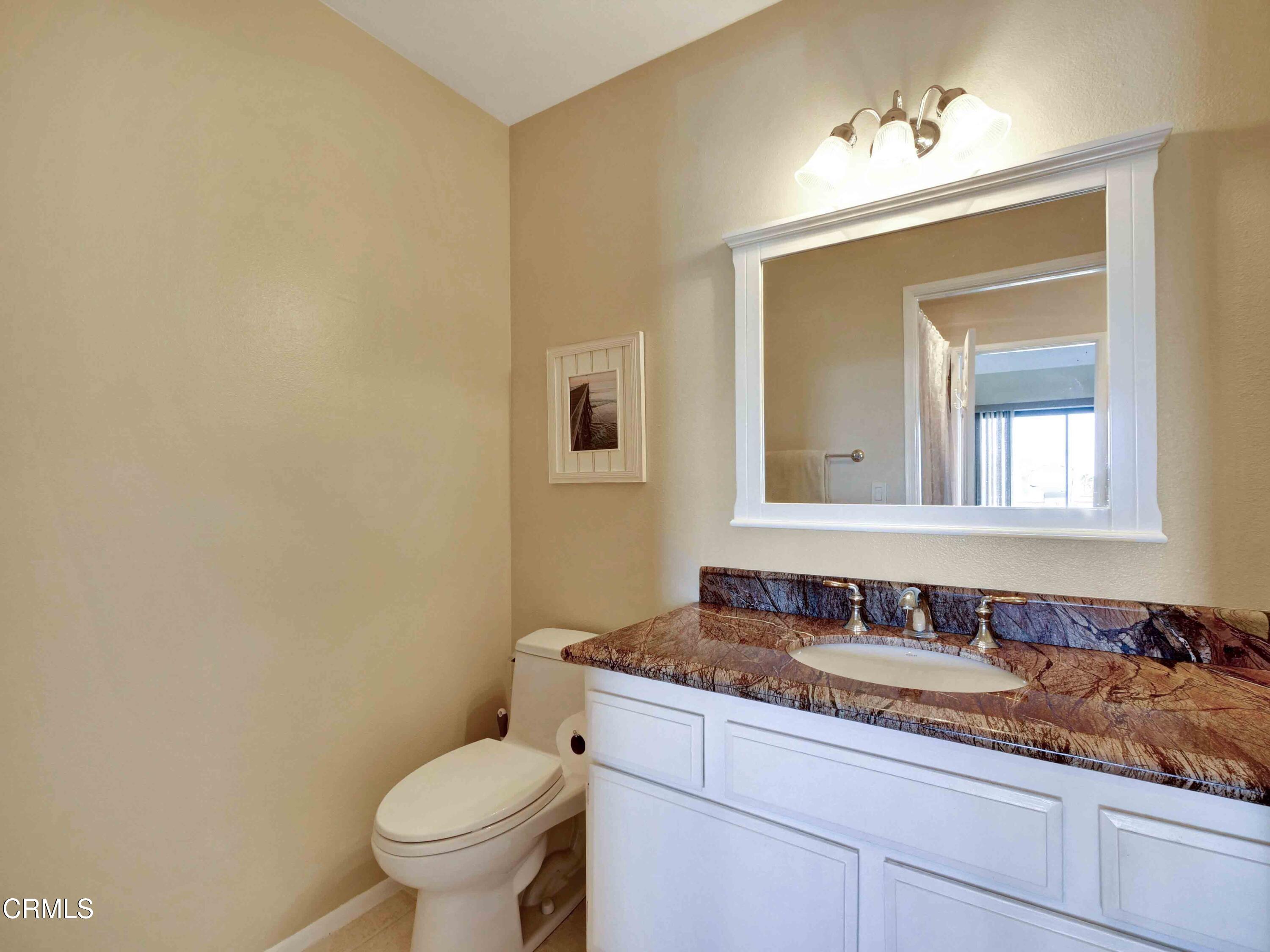 558 Terrace View Place Port Hueneme, CA 93041 - Photo 34 of 52 a bathroom with a granite countertop sink and a toilet