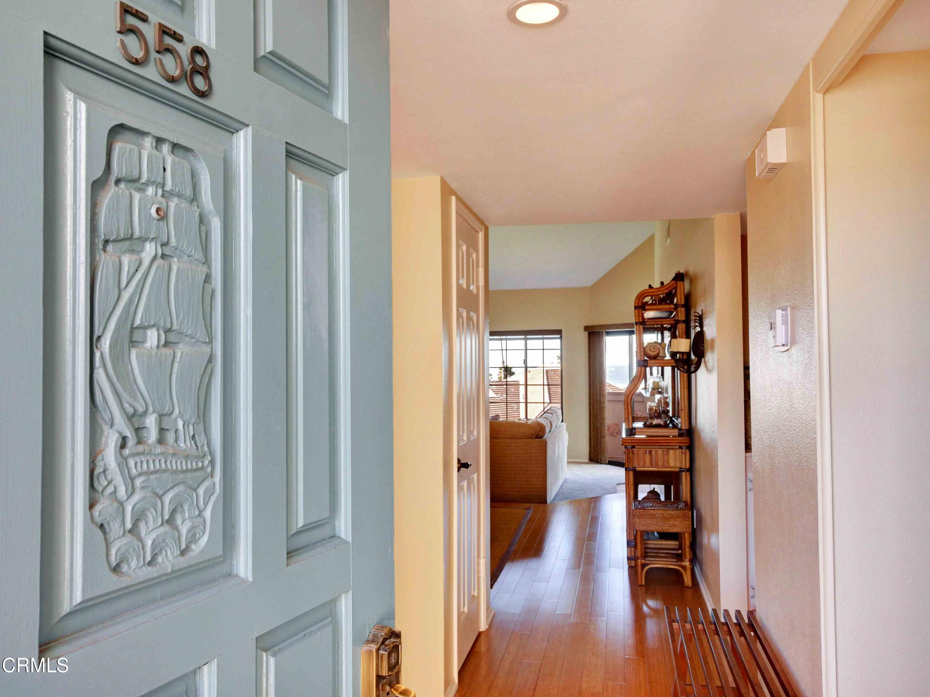 558 Terrace View Place Port Hueneme, CA 93041 - Photo 4 of 52 a view of a hallway with wooden floor and stairs