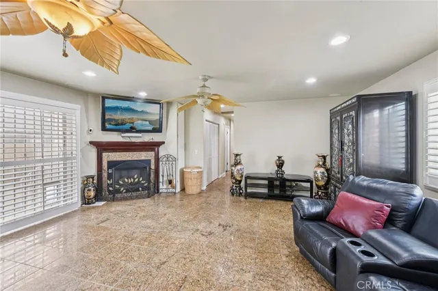 a living room with furniture and a fireplace
