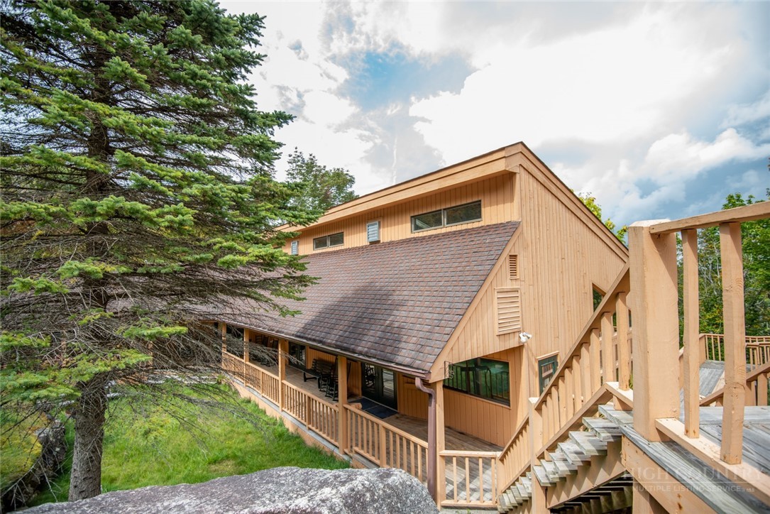 220 Charter Hills Road, Unit C3 Beech Mountain, NC 28604 - Photo 21 of 32 a view of house with backyard and deck