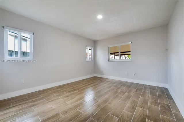 a view of an empty room and window