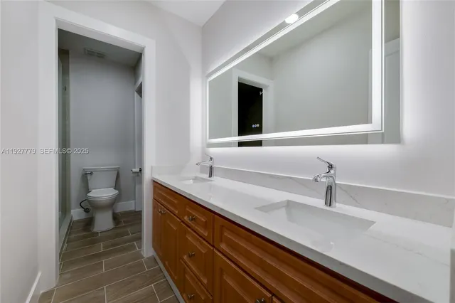 a bathroom with a sink and a toilet