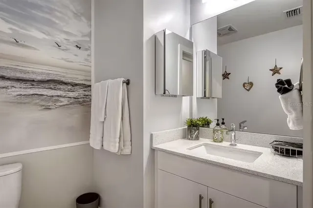 a bathroom with a sink and mirror