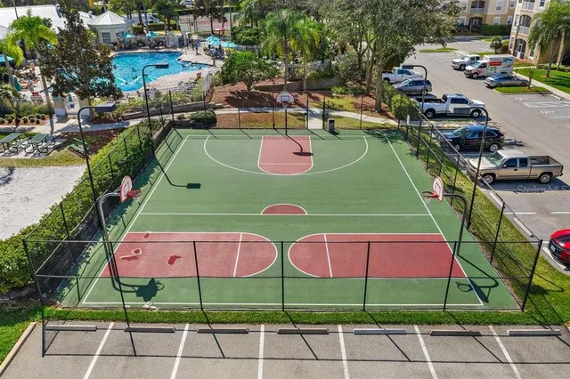 a view of a playground with basketball court