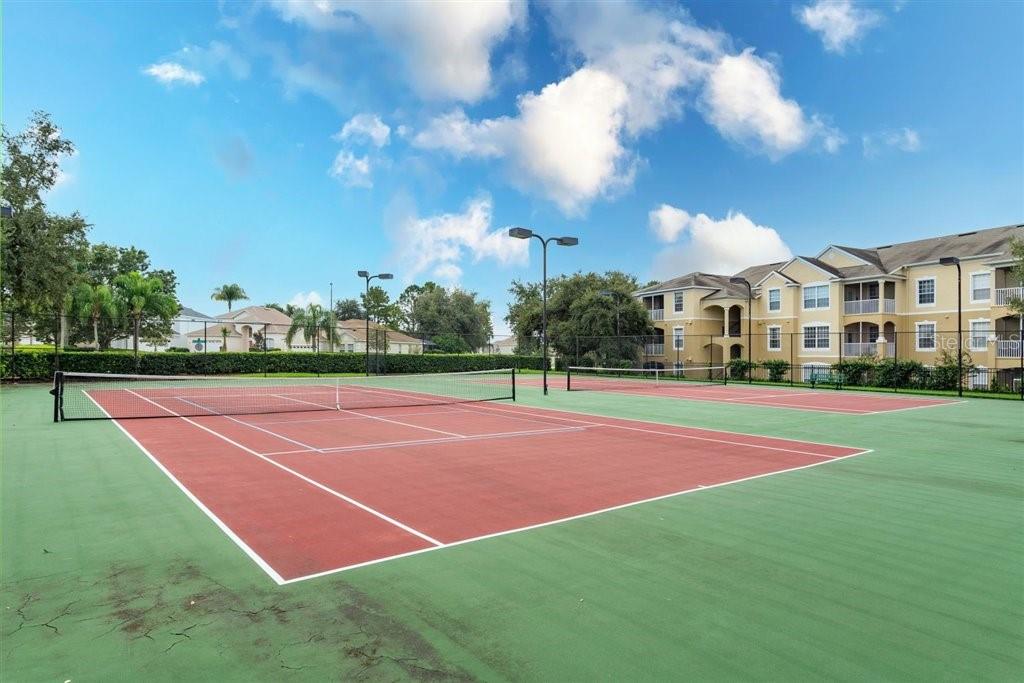 2307 Silver Palm Drive, Unit 202 Kissimmee, FL 34747 - Photo 29 of 34 a tennis court that has houses in the background