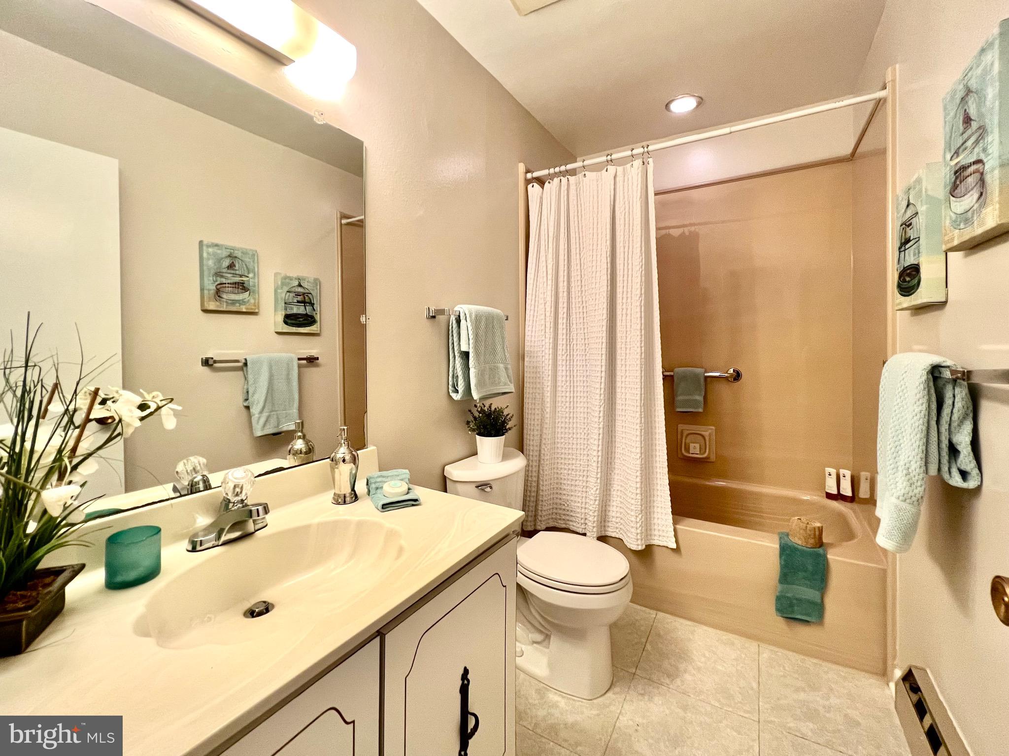 3413 St Leonards Court, Unit 110A Silver Spring, MD 20906 - Photo 23 of 50 2nd full bath with new tub enclosure.