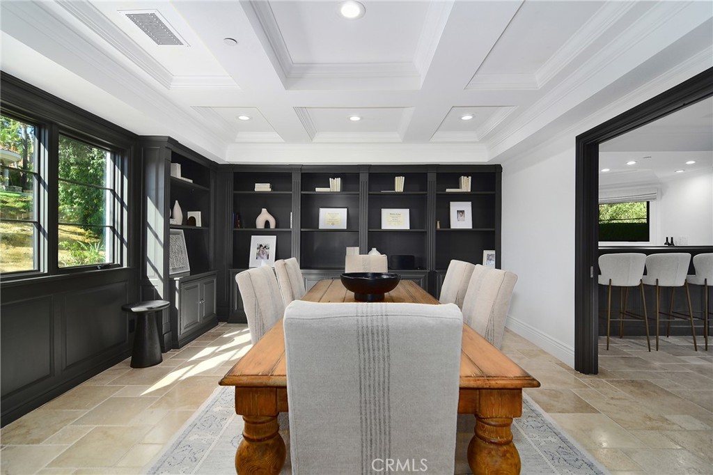 4947 Summit View Drive Westlake Village, CA 91362 - Photo 12 of 61 a living room with furniture a lamp wooden floor and a large window