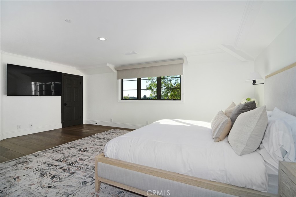 4947 Summit View Drive Westlake Village, CA 91362 - Photo 26 of 61 a bedroom with a bed and a window