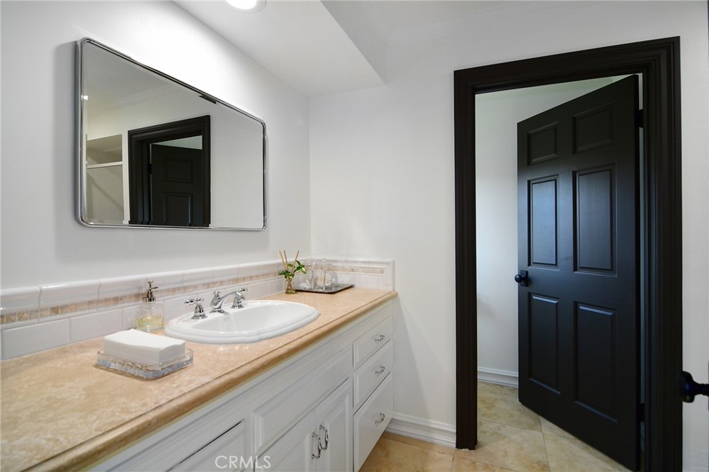 4947 Summit View Drive Westlake Village, CA 91362 - Photo 31 of 61 a bathroom with a sink and a mirror