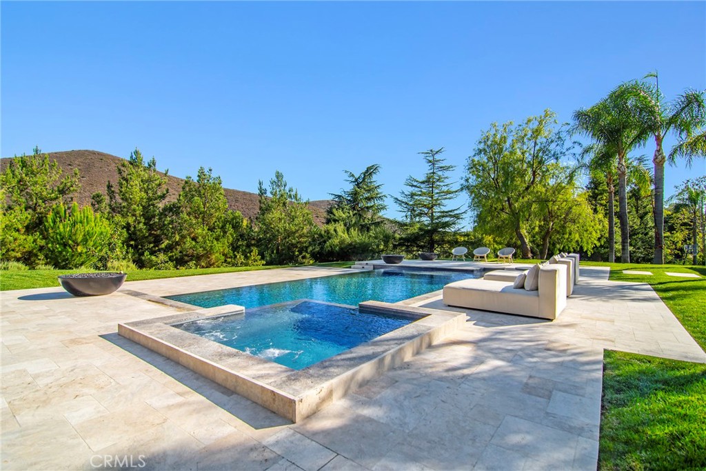 4947 Summit View Drive Westlake Village, CA 91362 - Photo 35 of 61 a view of a swimming pool with a patio