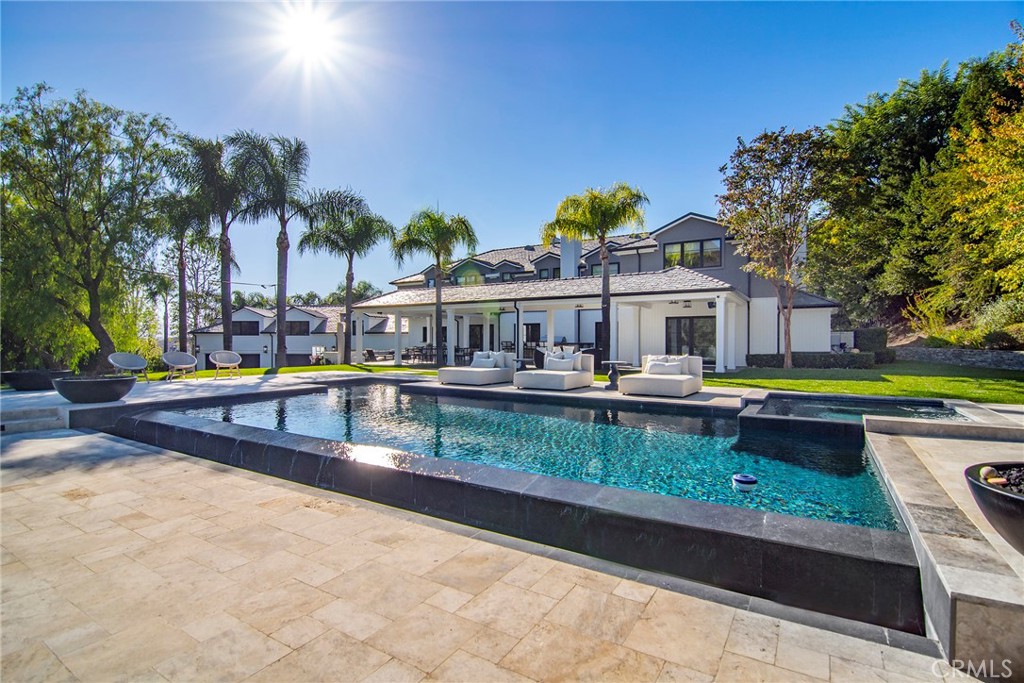 4947 Summit View Drive Westlake Village, CA 91362 - Photo 36 of 61 swimming pool view with a seating space and a garden view