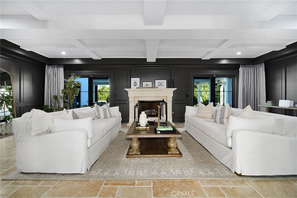 4947 Summit View Drive Westlake Village, CA 91362 - Photo 5 of 61 a living room with furniture a fireplace and a large window