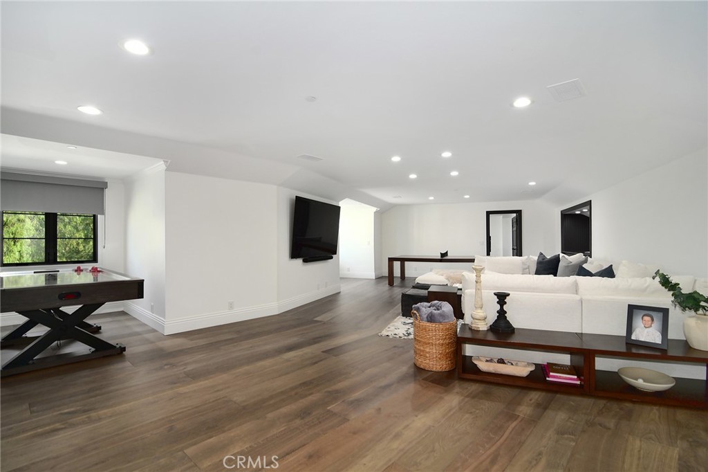 4947 Summit View Drive Westlake Village, CA 91362 - Photo 54 of 61 a living room with furniture flat screen tv and a table