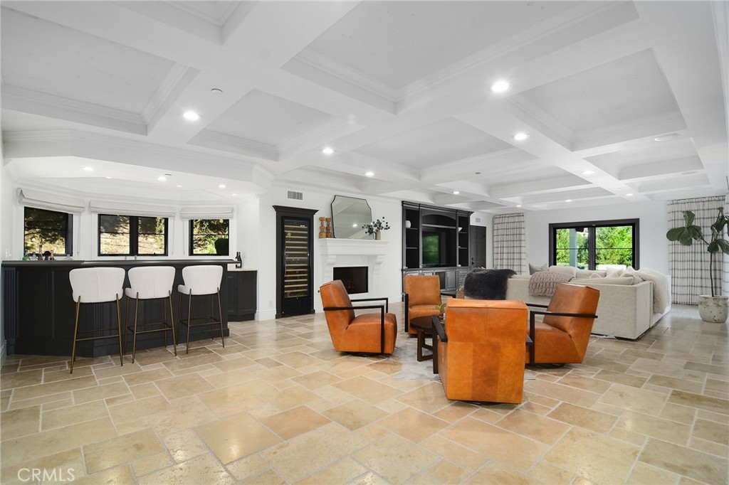 4947 Summit View Drive Westlake Village, CA 91362 - Photo 7 of 61 a living room with furniture large window and fireplace