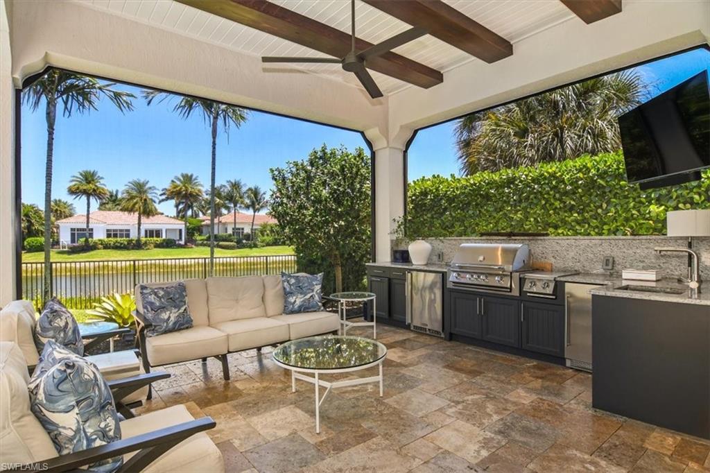 2220 Residence Circle Naples, FL 34105 - Photo 28 of 50 a outdoor dining space with furniture