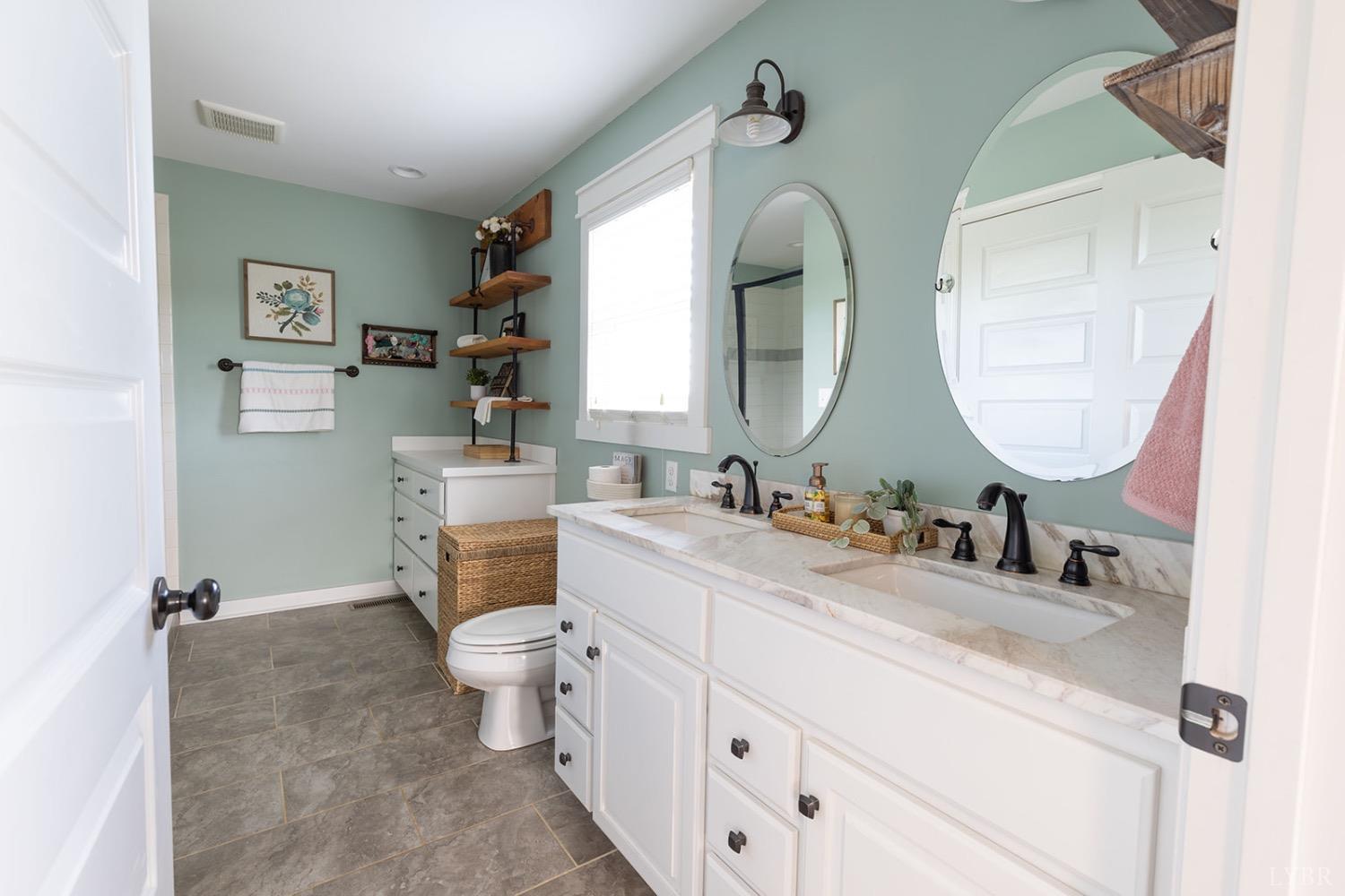 2490 Red House Road Rustburg, VA 24588 - Photo 17 of 33 a bathroom with a toilet sink and mirror