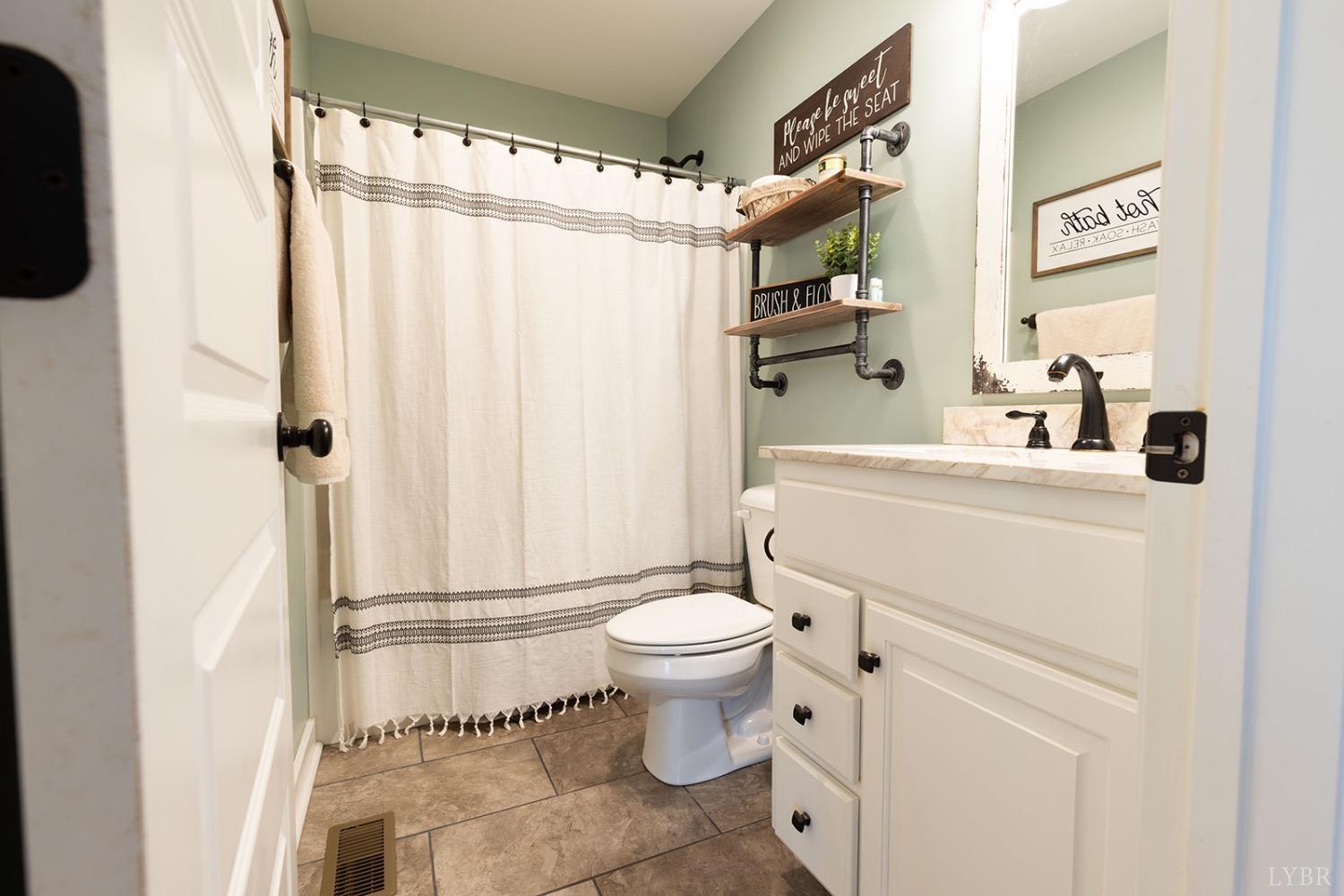 2490 Red House Road Rustburg, VA 24588 - Photo 23 of 33 a bathroom with a sink toilet and shower