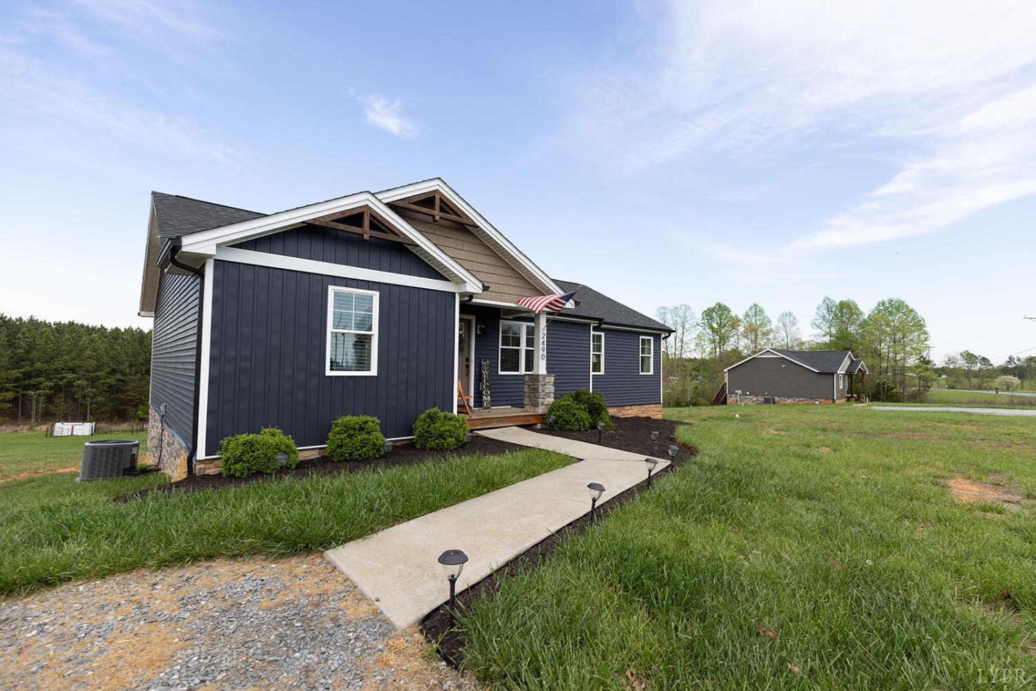 2490 Red House Road Rustburg, VA 24588 - Photo 3 of 33 a front view of a house with a yard