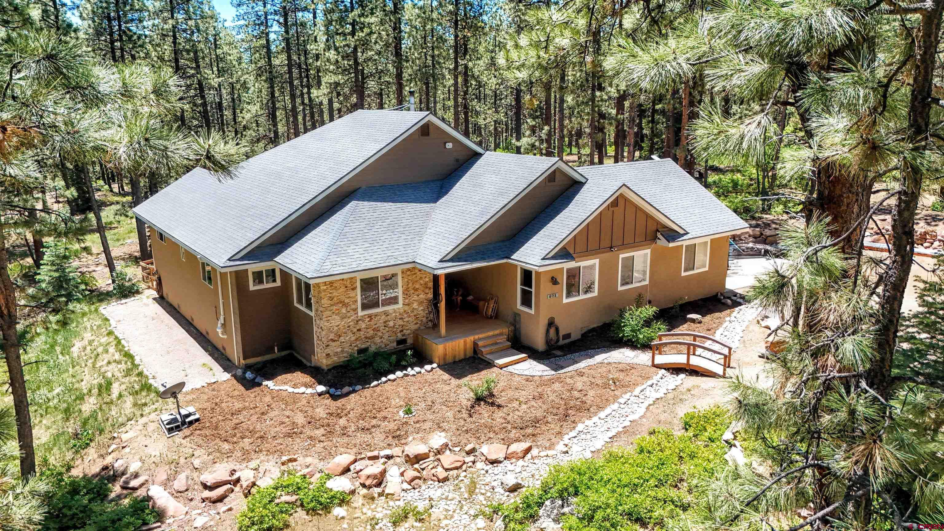 a aerial view of a house with a yard