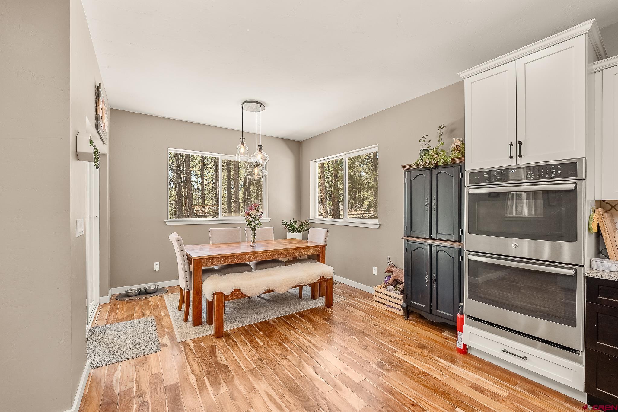 671 Sierra Circle Durango, CO 81301 - Photo 18 of 35 a room with wooden floor and furniture