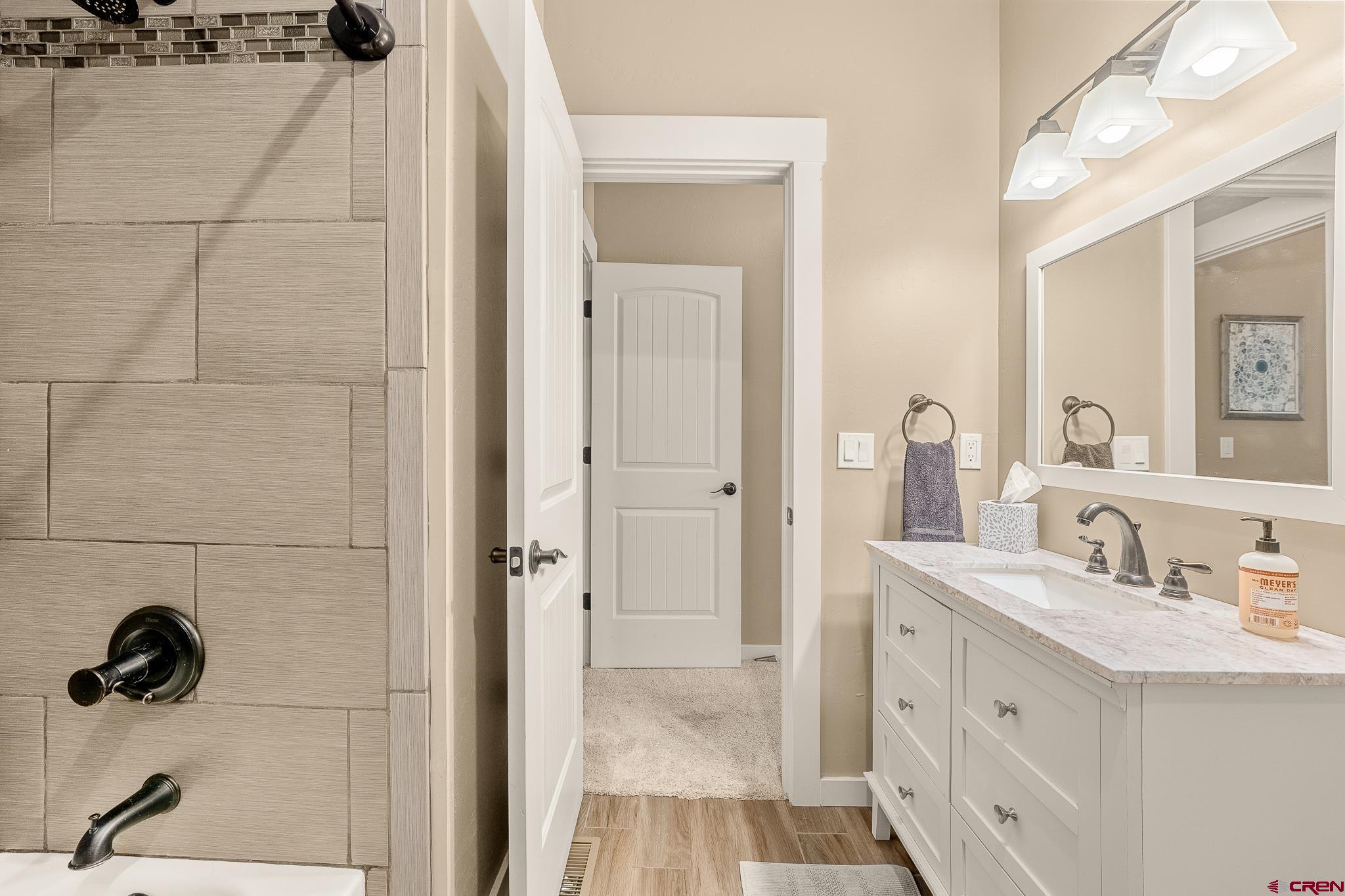 671 Sierra Circle Durango, CO 81301 - Photo 29 of 35 a bathroom with a sink and a mirror