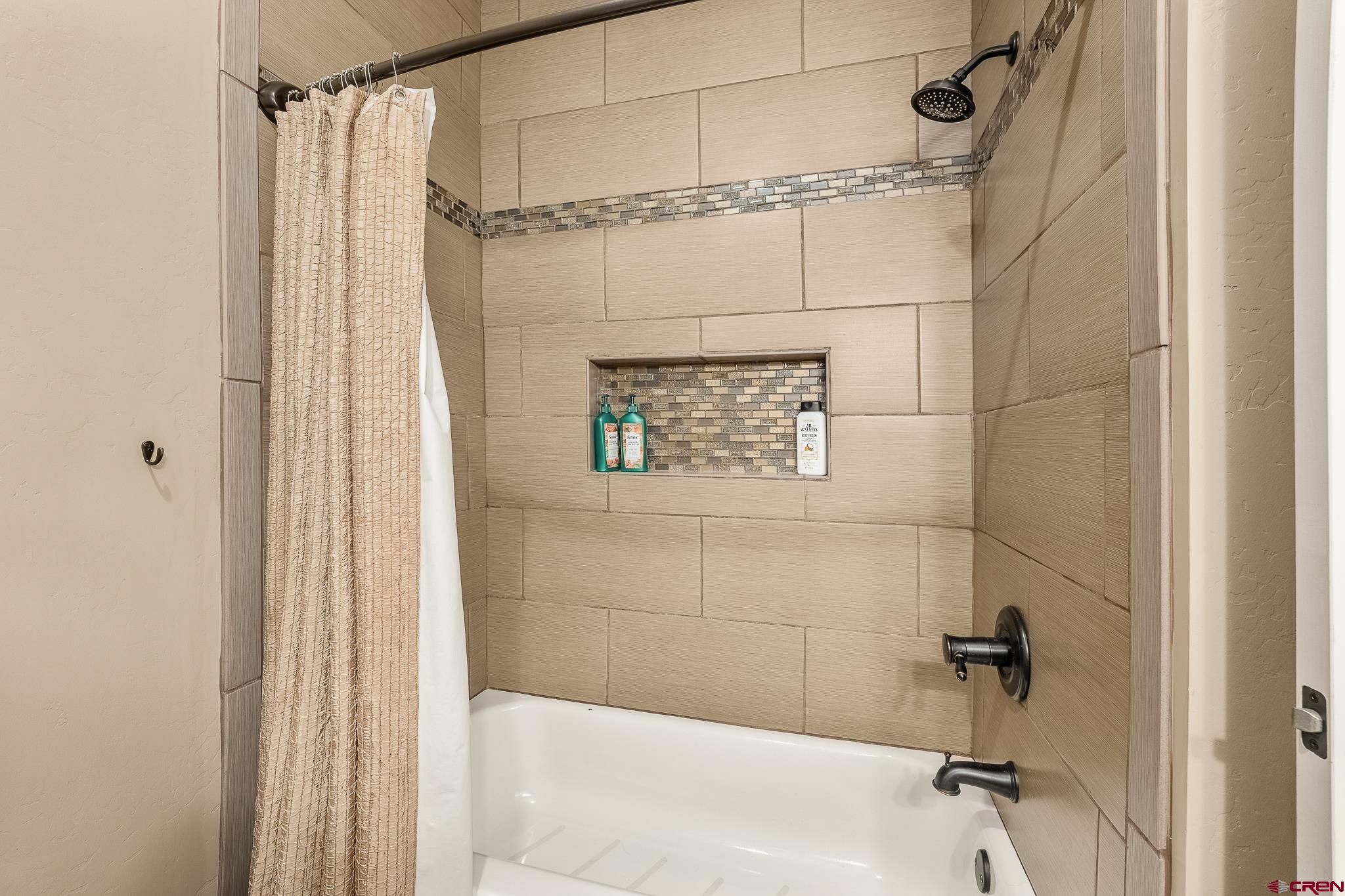 671 Sierra Circle Durango, CO 81301 - Photo 30 of 35 a bathroom with a shower and a shower