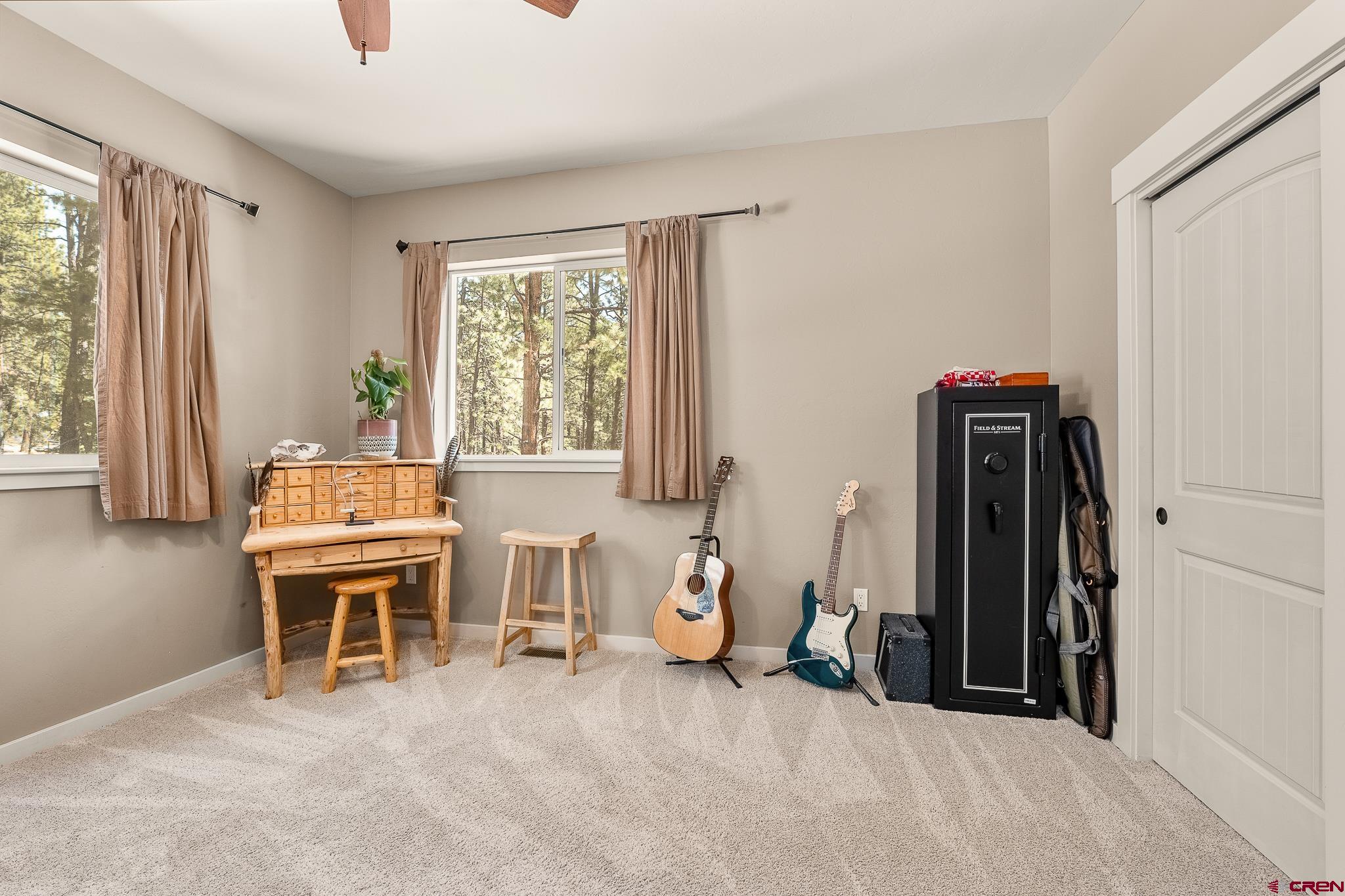 671 Sierra Circle Durango, CO 81301 - Photo 31 of 35 a living room with a window and a chair