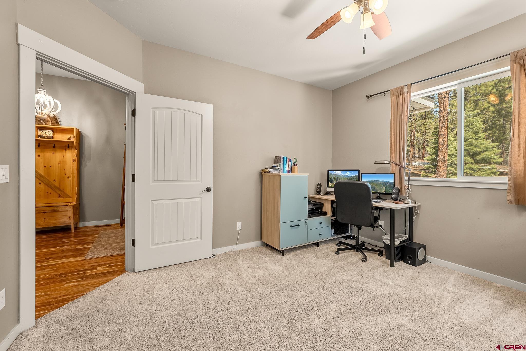671 Sierra Circle Durango, CO 81301 - Photo 32 of 35 a view of a workspace with furniture and a window