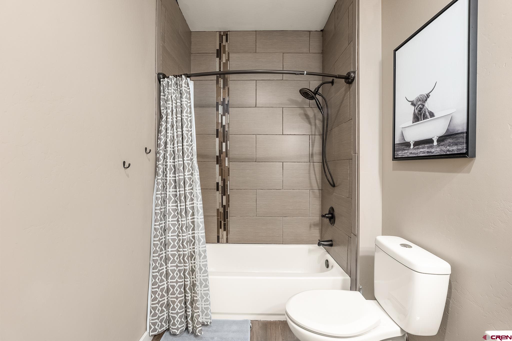 671 Sierra Circle Durango, CO 81301 - Photo 35 of 35 a bathroom with a toilet and shower