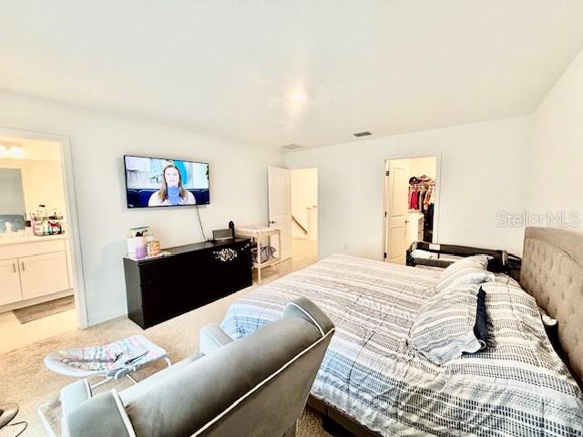 4520 Calvary Way St. Cloud, FL 34769 - Photo 6 of 9 a bedroom with a bed and a couch