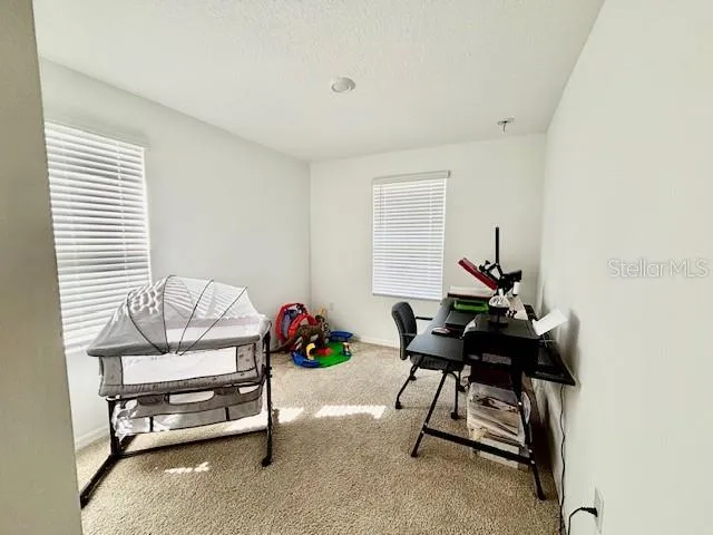 a view of a workspace with furniture