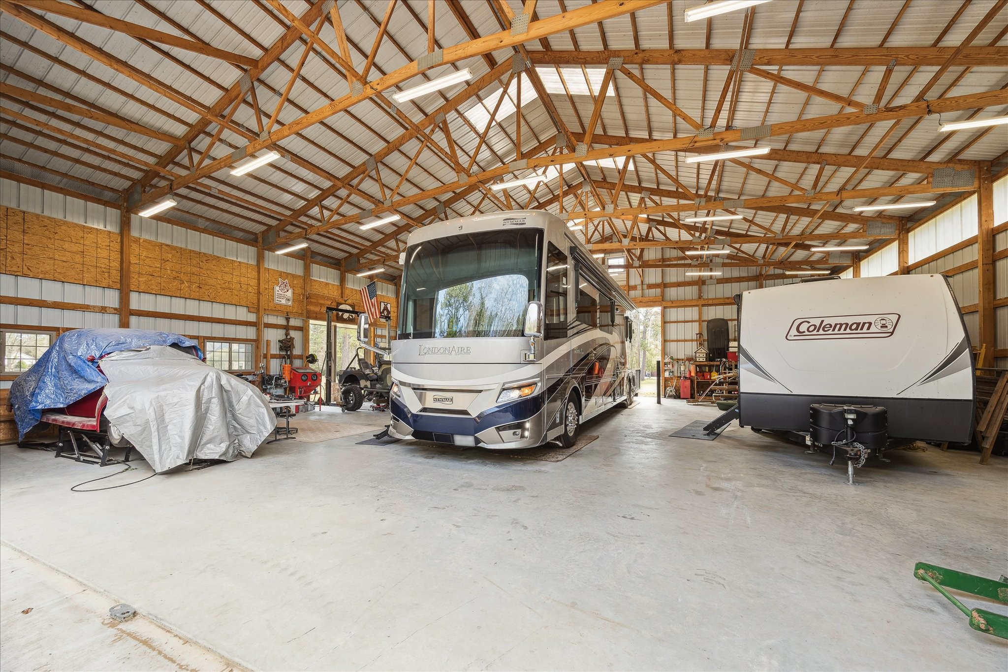 11 Willowcreek Ranch Road Tomball, TX 77377 - Photo 10 of 49 The interior of the Morton-built barn is expansive. It dwarfs the full-size RV storage inside. Also presently stored within is another camper and two vehicles with additional workspace and storage leftover!