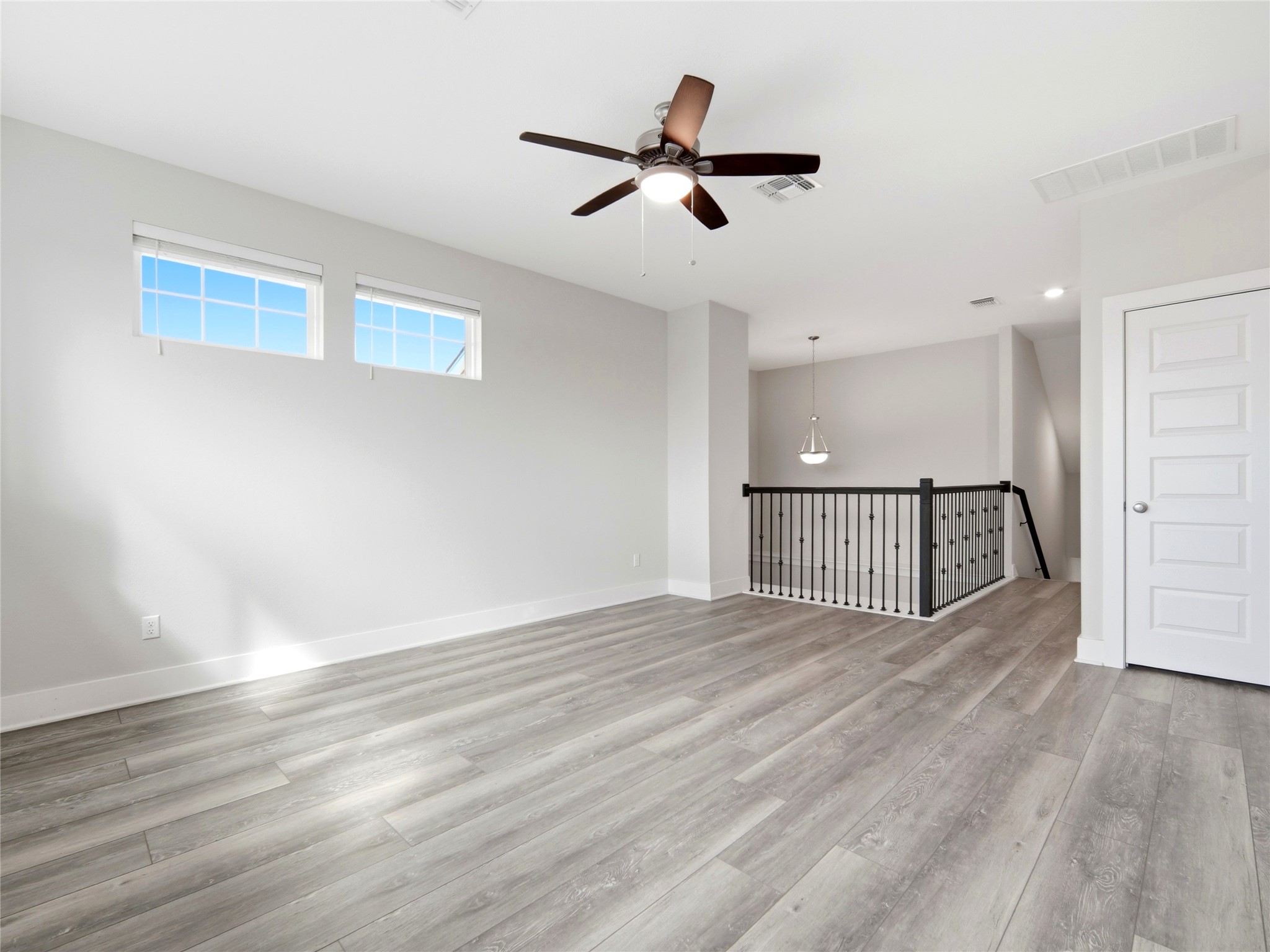 848 Wild Pecan Loop Buda, TX 78610 - Photo 15 of 49 Spacious upstairs game room with ceiling fan for comfort.