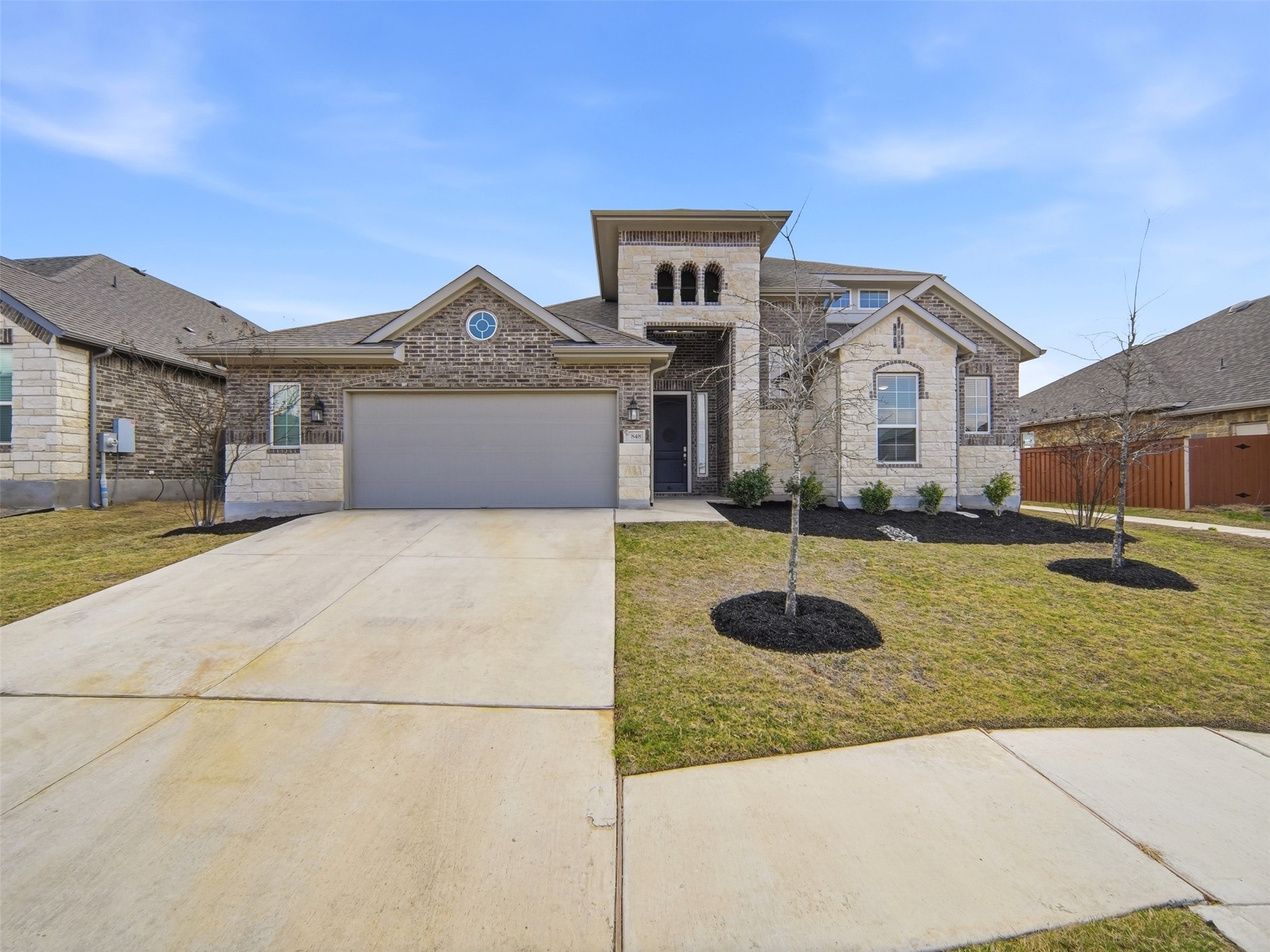 848 Wild Pecan Loop Buda, TX 78610 - Photo 16 of 49 This home features a built-in sprinkler system, a spacious 2.5-car garage with a window, and a water softener for added convenience.