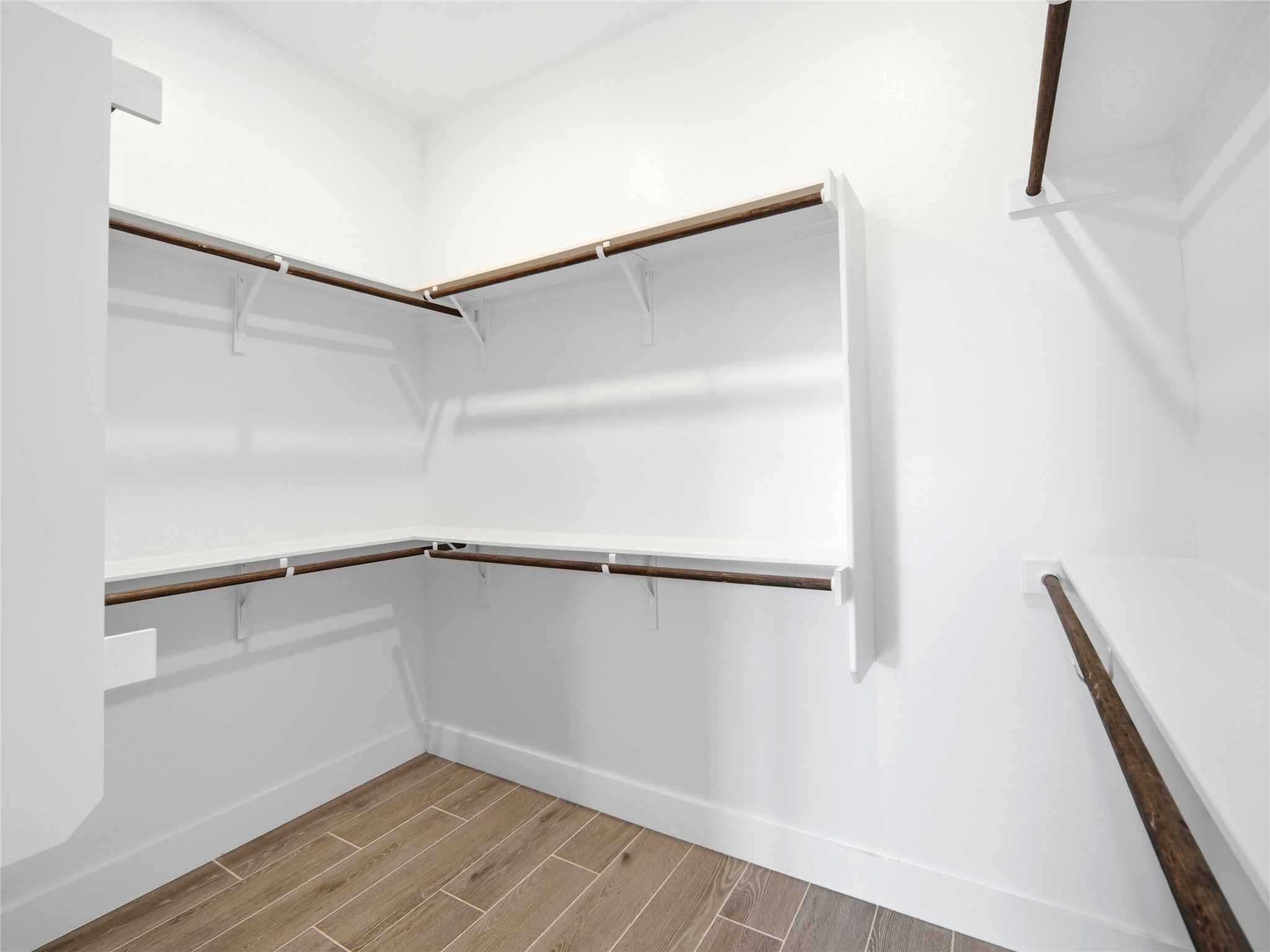 848 Wild Pecan Loop Buda, TX 78610 - Photo 17 of 49 Spacious walk-in closet in the master bedroom offers ample storage and organization.