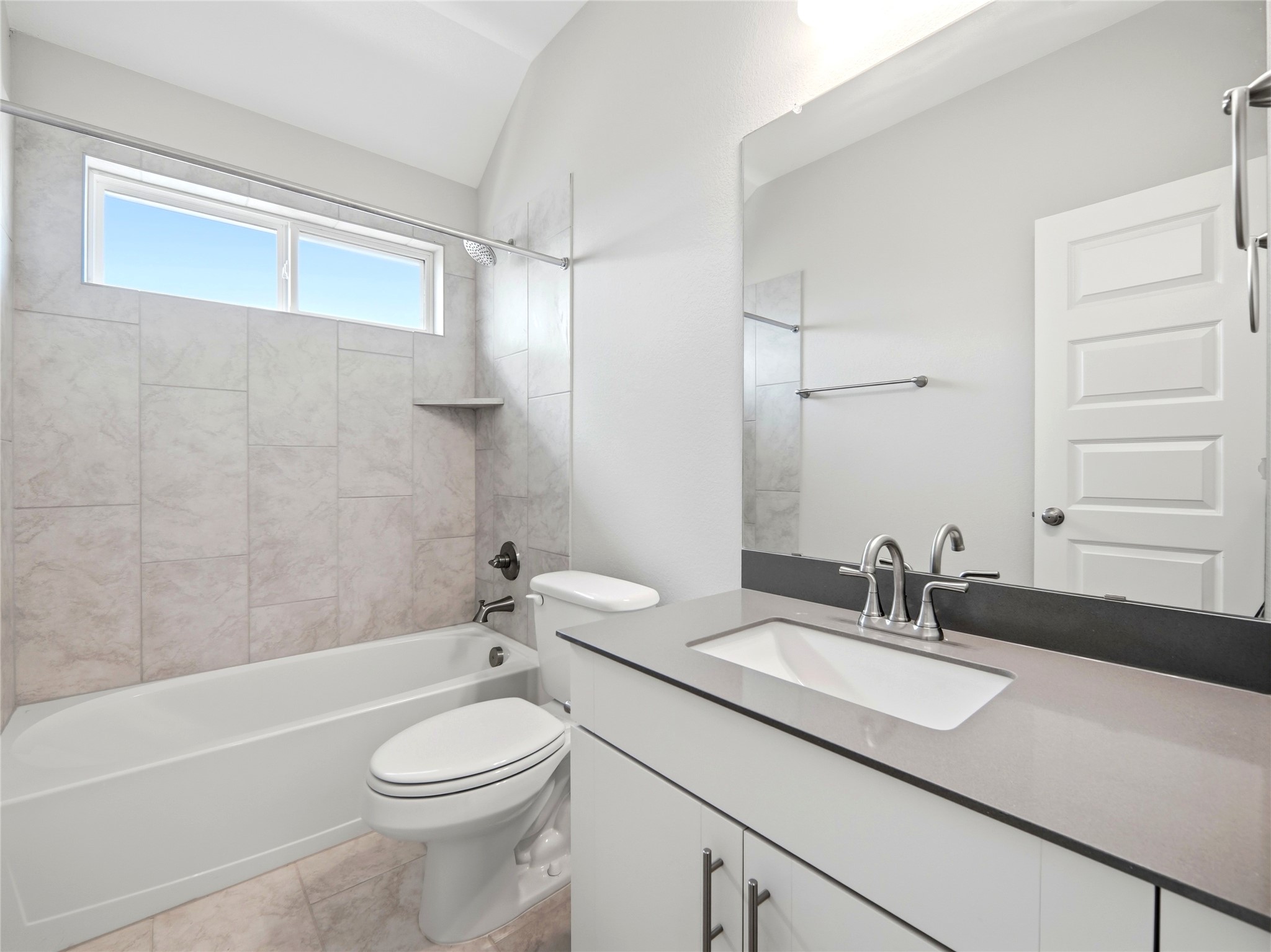 848 Wild Pecan Loop Buda, TX 78610 - Photo 18 of 49 Elegant full bathroom upstairs featuring modern fixtures and a sleek design.