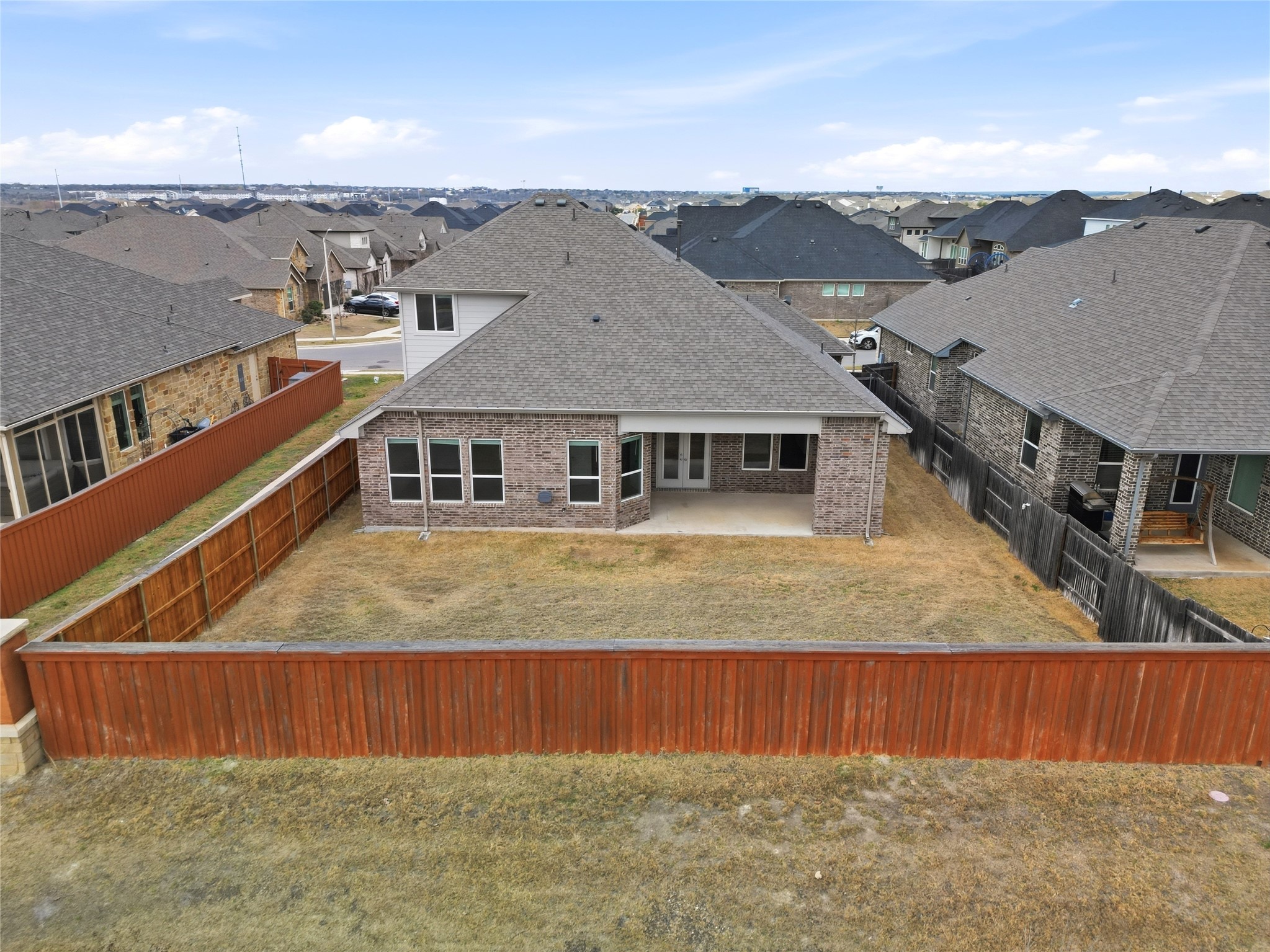 848 Wild Pecan Loop Buda, TX 78610 - Photo 19 of 49 Quiet comfort with the A/C unit strategically placed on the side of the home, ensuring peaceful bedrooms.