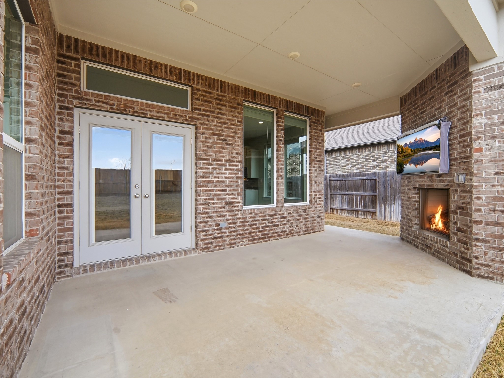 848 Wild Pecan Loop Buda, TX 78610 - Photo 23 of 49 Charming back porch with elegant French doors, perfect for indoor-outdoor living.