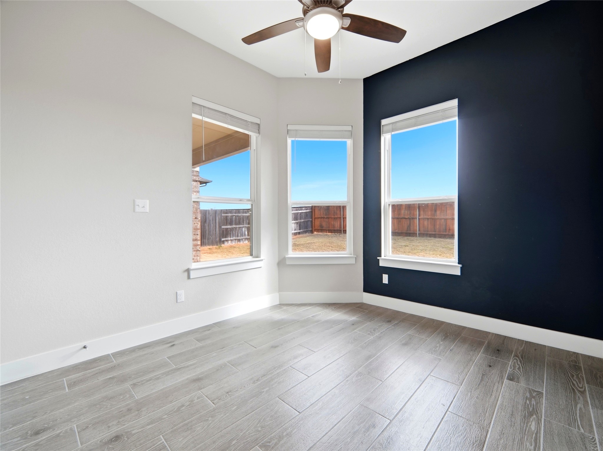 848 Wild Pecan Loop Buda, TX 78610 - Photo 24 of 49 Bright and airy office/study with ceiling fan and expansive windows.