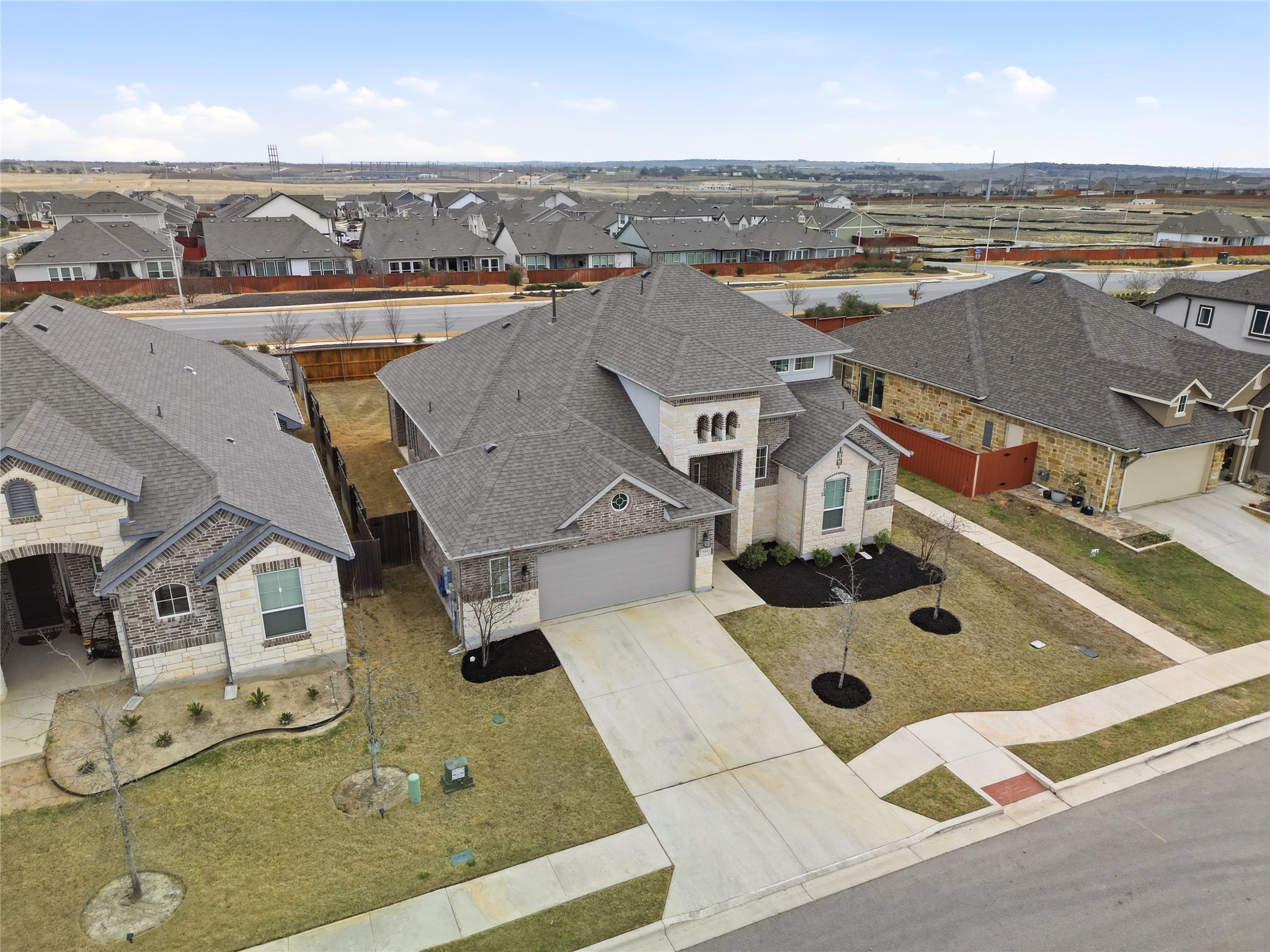 848 Wild Pecan Loop Buda, TX 78610 - Photo 26 of 49 This property features built-in sprinklers and gutters, with convenient access to a scenic walking path right next door.